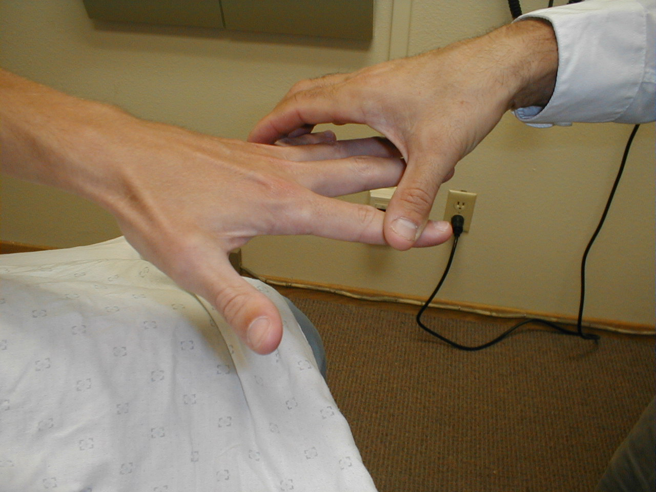 Intrinsic muscles of the hand (abduction) (Image courtesy of Charlie Goldberg, M.D., UCSD School of Medicine and VA Medical Center, San Diego, California)